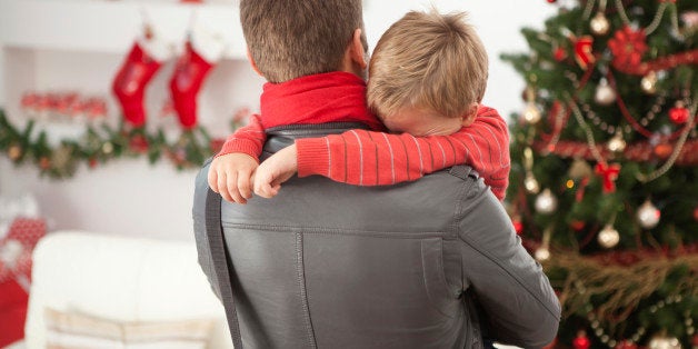 'Crying little boy hided his face into father's shoulder.Please, see CHRISTMAS images with this FAMILY, for lightbox click the image below.'