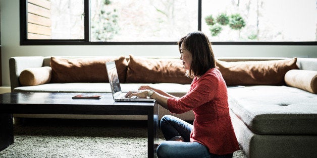 woman using laptop at home