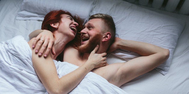 beautiful couple lying together on the bed