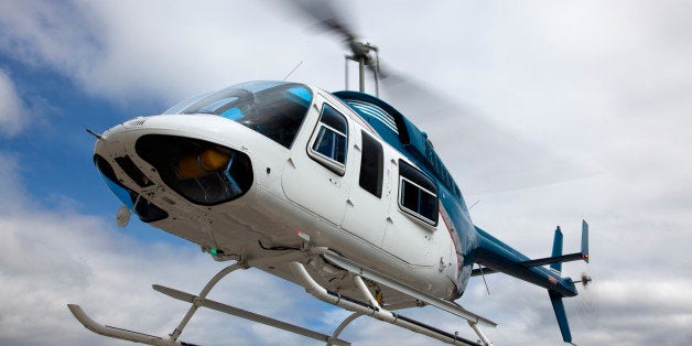 A Bell 206 helicopter in flight.