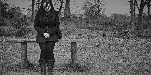 woman alone on park bench...