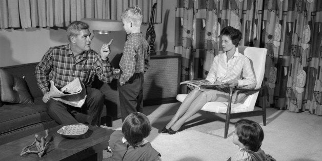 1960s FAMILY OF FOUR IN LIVING ROOM BOY IS BEING DISCIPLINED BY DAD SHAKING FINGER (Photo by H. Armstrong Roberts/ClassicStock/Getty Images)