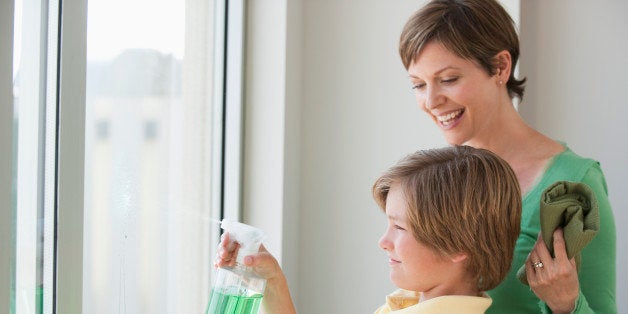 Mother and son washing windows