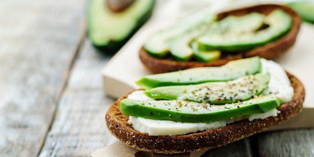 sandwich of rye bread with avocado and goat cheese. tinting. selective focus