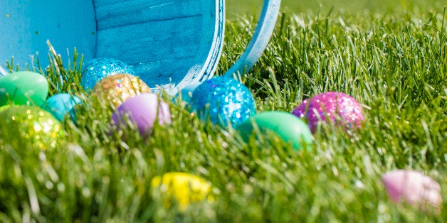 A stock photo of Decorated Easter eggs in an Easter. Photographed with low depth of field with a green grass background. Photographed using the Canon EOS 5DSR at 50mp and the 100mm f2.8 IS L macro lens. Perfect for designs or articles about easter or an easter egg hunt.