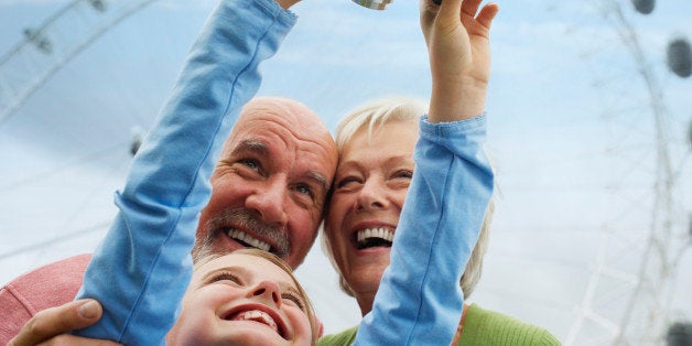 Grandparents and Granddaughter with Digital Camera