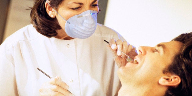 Dental hygienist and patient