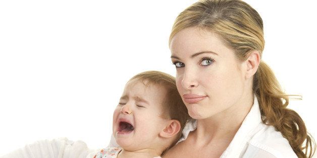 sad mom with crying toddler on white background