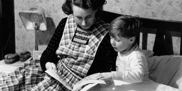 30th January 1954: Scotland's youngest film star Vincent Winter is ready for bed and Mum tells him a story. Original Publication: Picture Post - 6884 - Vincent Winter: Scotland's Youngest Film Star - pub. 1954 (Photo by Carl Sutton/Picture Post/Getty Images)