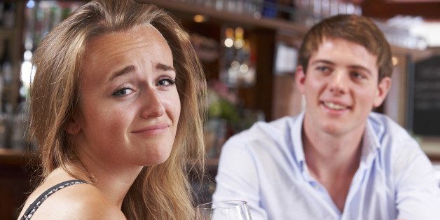 Couple On Unsuccessful Blind Date In Restaurant