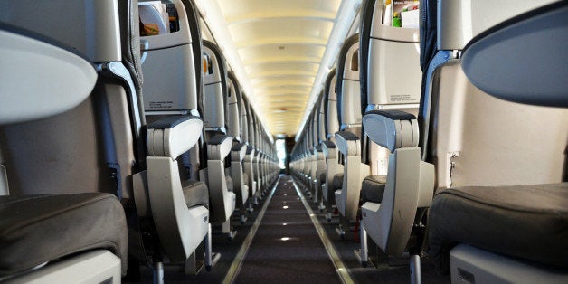 Single aisle airliner cabin interior.