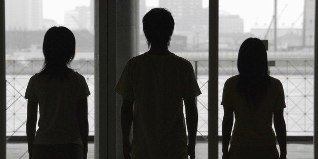 Silhouette of three people