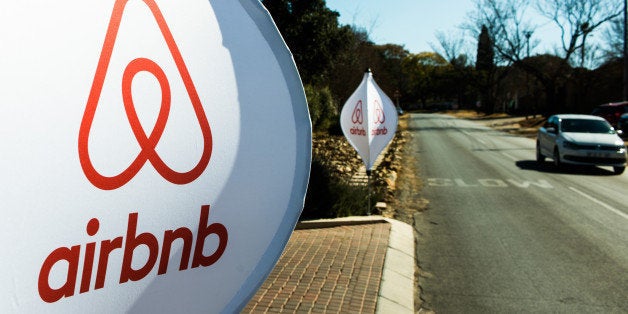 The logos of Airbnb Inc. sit on banners displayed outside a media event in Johannesburg, South Africa, on Monday, July 27, 2015. Airbnb is hoping to spread its unique brand of hospitality throughout Africa. Photographer: Waldo Swiegers/Bloomberg via Getty Images