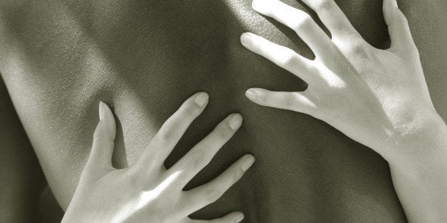 Womans hands on mans back