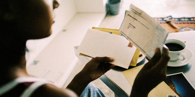 Close-up of a person sorting mail