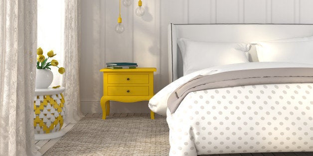 Modern bedroom in white color with yellow accents