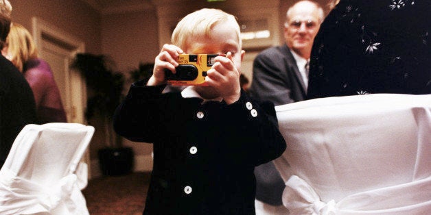 SMALL BOY (3-5) USING DISPOSABLE CAMERA