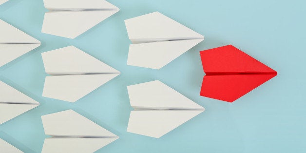 red paper plane leading white ones, leadership concept