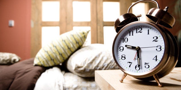 Alarm clock on nightstand in bedroom