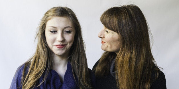 Close shot of mother looking humorously at her teenage daughter.