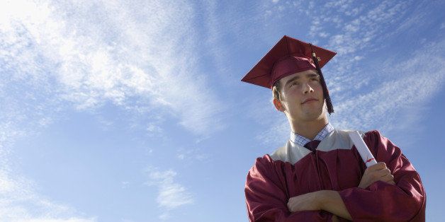 Teenage boy with diploma