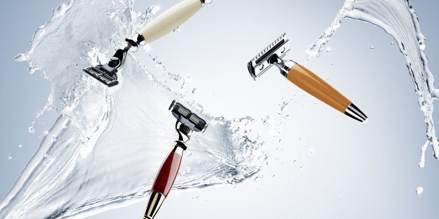 shaving razor blade, watersplash, water droplets, blue background