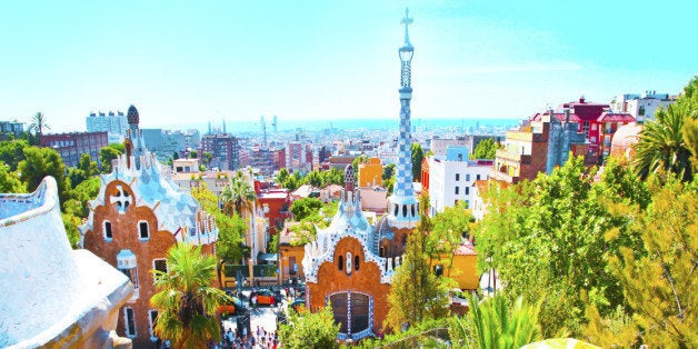 The Famous Summer Park Guell over bright blue sky in Barcelona, Spain