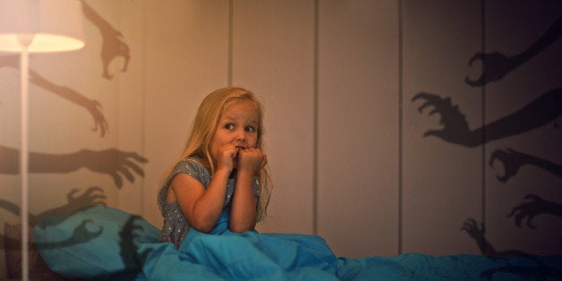 Shot of a frightened little girl being kept awake by scary shadowshttp://195.154.178.81/DATA/i_collage/pi/shoots/783573.jpg