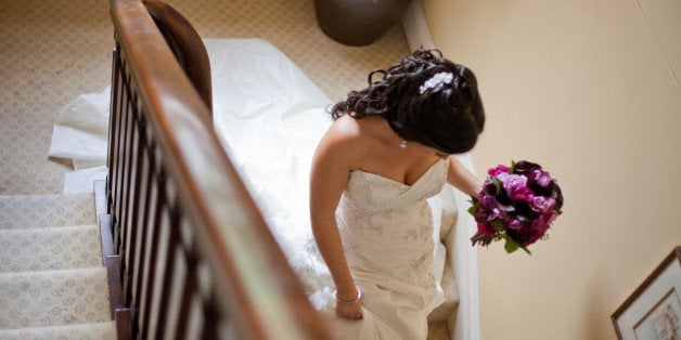 Bride walking down stairs