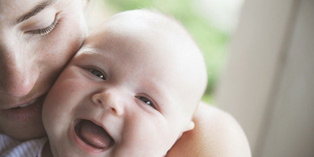 Close-up of a woman smiling with her son