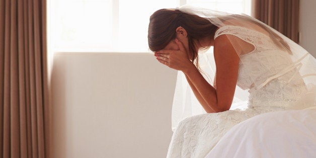 Bride In Bedroom Having Second Thoughts Before Wedding