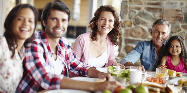 A happy family enjoying a meal time together