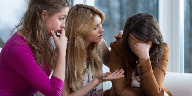 Three girl friends overcoming a difficult problem