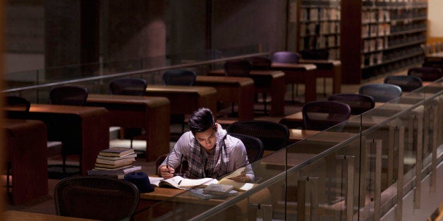 Student working in library at night