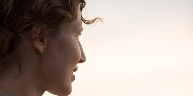 Side profile of a mid adult woman looking away