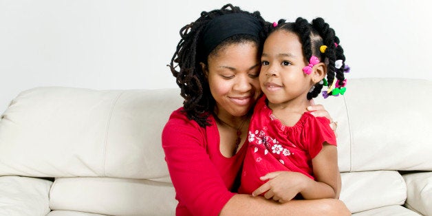 Woman embracing girl