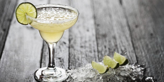 Margarita on wood table, with ice and lime decoration