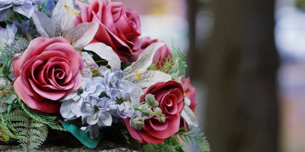 Silk flowers on a gravestone