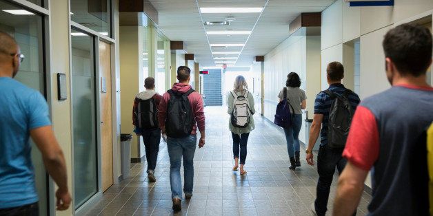 College students walking down corridor