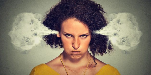 Closeup portrait of angry young woman, blowing steam coming out of ears, about to have nervous atomic breakdown, isolated gray background. Negative human emotions facial expression feelings attitude