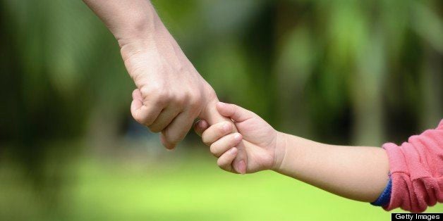 Mother and Child Holding Hands.