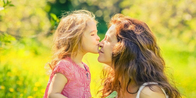 Mother and daughter in spring sunny park