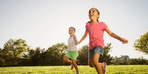 USA, California, Ladera Ranch, Sisters (6-7, 8-9) playing in park