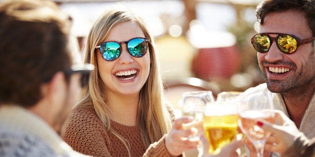 Friends toasting each other with wine