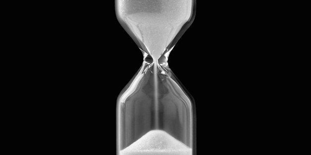 Egg timer against black background, close-up