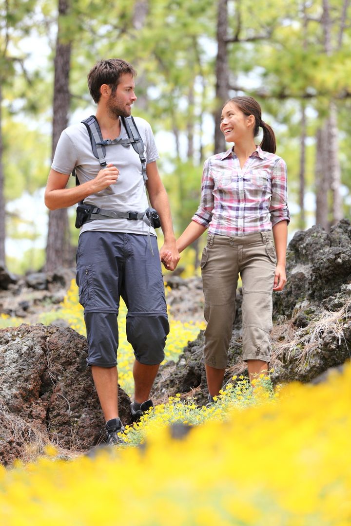 hiking couple walking in forest....