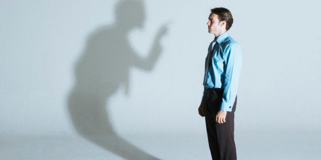 Man being scolded by his shadow