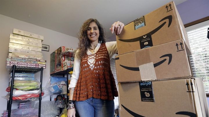 Adrienne Kosewicz, owner of Play It Safe World Toys, in her home office in Seattle. An internet seller, Kosewicz pays for tax collection software to handle payments to her home state. The U.S. Supreme Court decided in June to allow states to collect sales taxes when their residents buy online, and a handful of states have already begun collecting. 