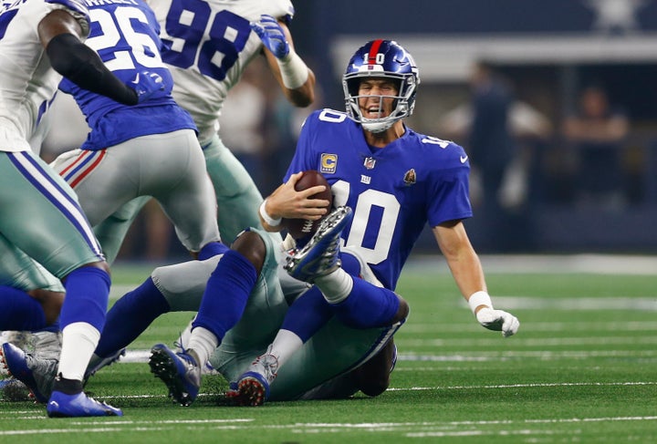 Eli Manning gets sacked by the Cowboys' Demarcus Lawrence.