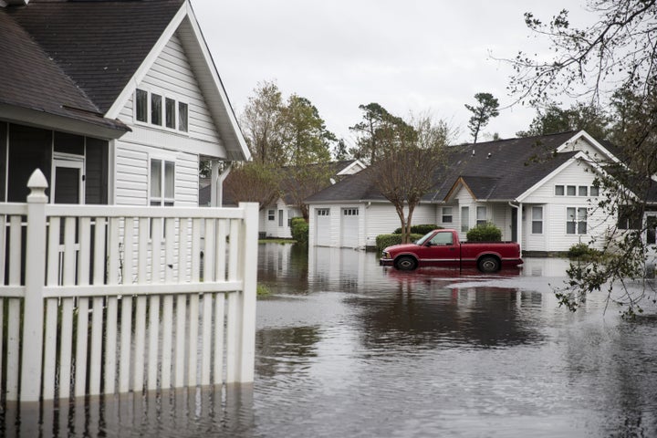 A truck sits partially submerged in a flooded neighborhood after Hurricane Florence hit in Wilmington, North Carolina, U.S., on Saturday, Sept. 16, 2018.